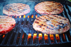 hamburger patties on a grill